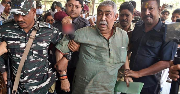 Anubrata Mandal, TMC leader, surrounded by police personnel