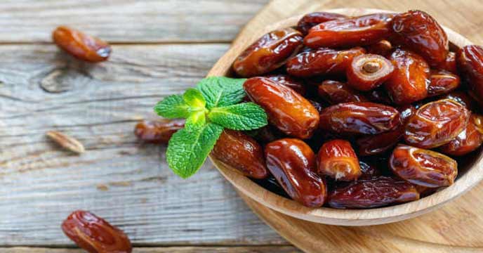A plate of dates with a caption that reads 'Discover the Power of Dates for Combating Brain Problems