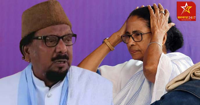 Mamata Banerjee and Abdul Karim Chowdhury smiling and waving hands at a public rally