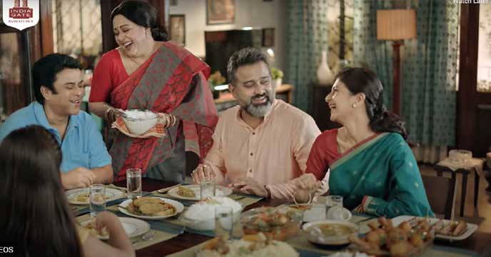 A bowl of cooked India Gate Basmati Rice on a wooden table