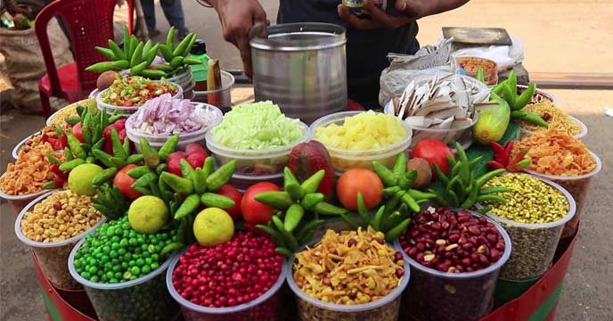 A bowl of Jhal Muri, a popular Bengali street food snack.