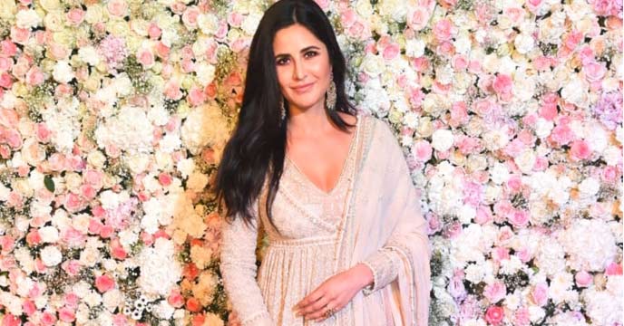Katrina Kaif in a flowy dress at a public event.