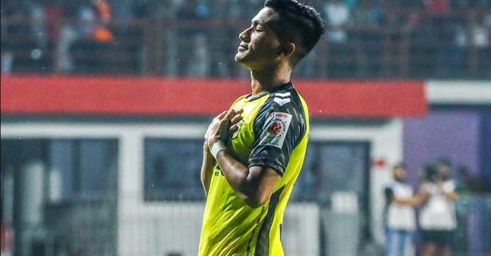Hyderabad FC star footballer Mohammad Yasir dribbling the ball on the field