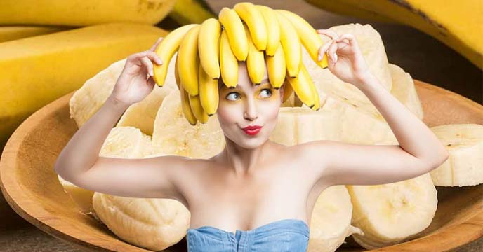 Indian girl enjoying a healthy snack of ripe bananas
