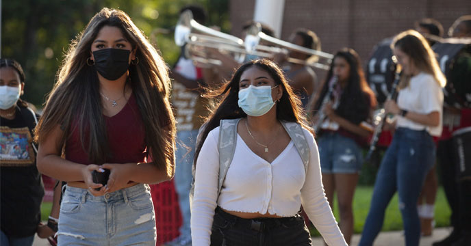Indian girl wearing a face mask as a precaution against COVID-19
