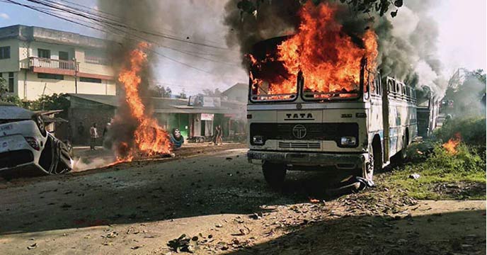 Fire-ravaged buildings in Manipur