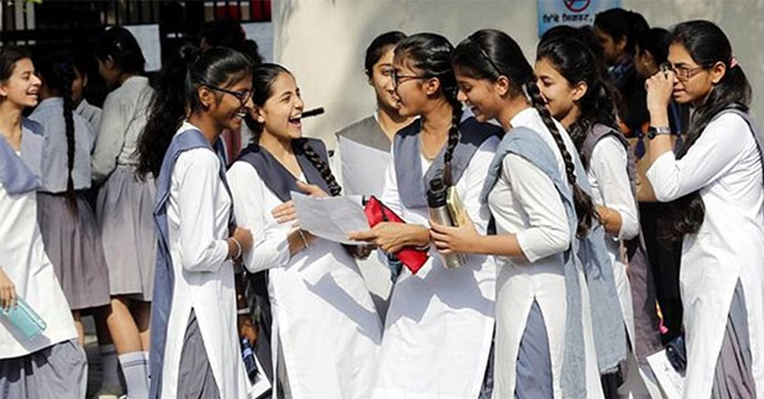 Photo of a smiling student, likely in a school or college setting, with a backpack and books, conveying a sense of learning and academic enthusiasm.