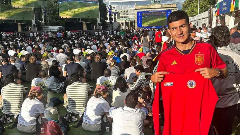 Saul Crespo Embraces Euro Spirit in Berlin with Red-and-Yellow T-Shirt in Hand"