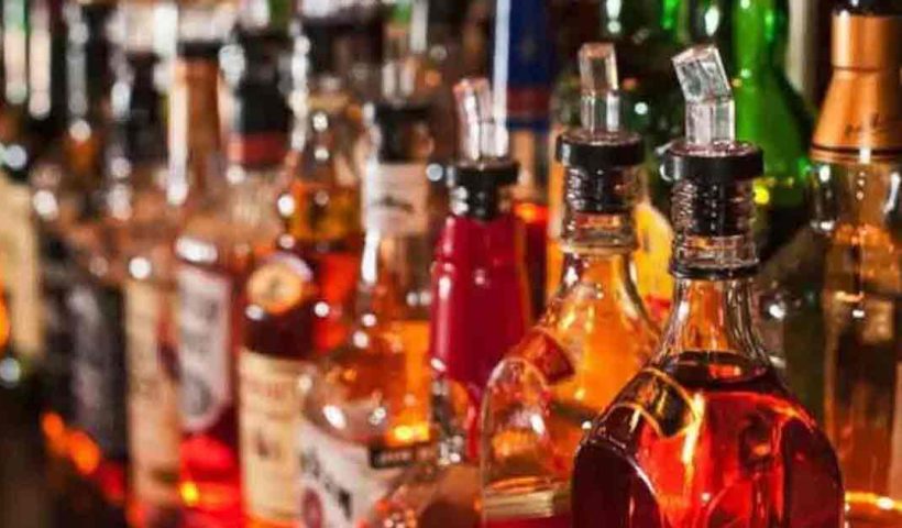 Image of bottles of various liquors arranged neatly on shelves