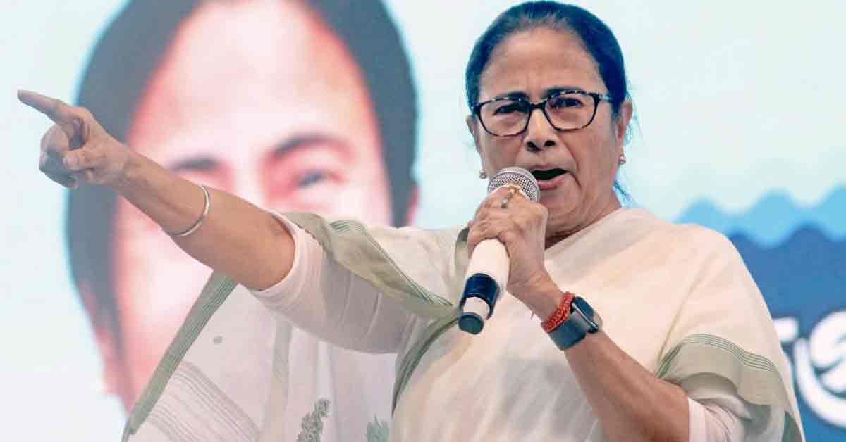 Portrait of Mamata Banerjee, the Chief Minister of West Bengal, wearing a traditional white saree and offering a namaste gesture.