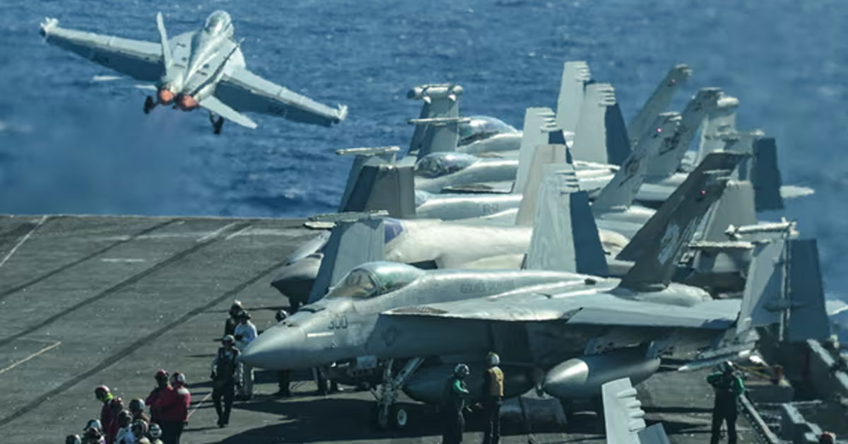 An F/A-18 fighter jet takes off from a US aircraft carrier